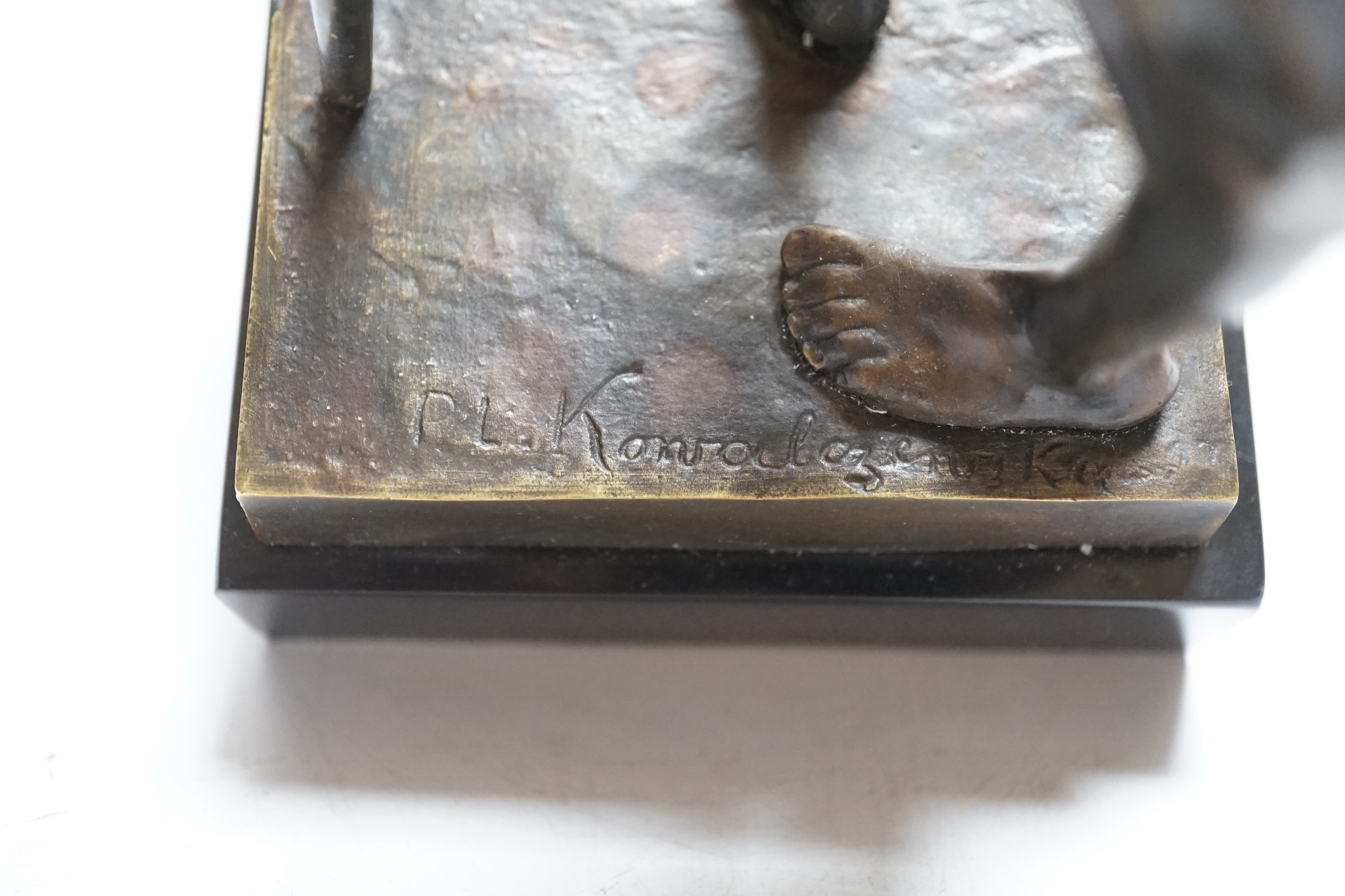 After Paul Ludwig Kowalczewski, a bronze of an African wine seller, 24cm